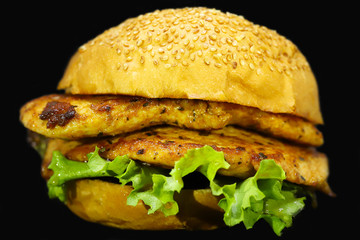 Fresh tasty burger isolated on black background