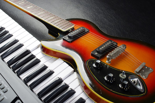 Electric guitar and piano keyboard.