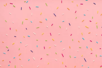 Tuinposter trendy pattern of colorful sprinkles for background of design banner, poster, flyer, card, postcard, cover, brochure over pink © Alisa