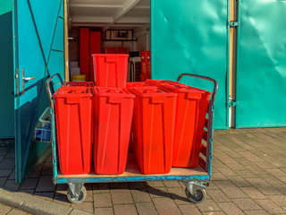 Collected medical waste containers are stored in a transport box for transport. Concept: Health,...