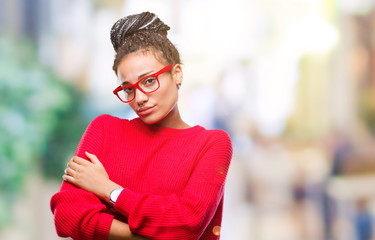 Young braided hair african american girl wearing sweater and glasses over isolated background...