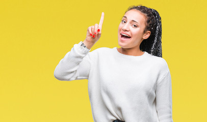 Young braided hair african american girl wearing winter sweater over isolated background showing...