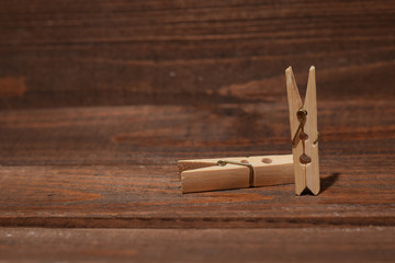 clothesoin on wooden background