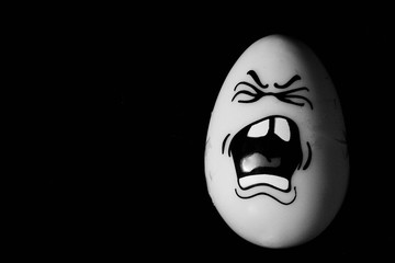 hurt egg in pain black background