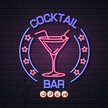 Neon sign cocktail bar on brick wall background. Vintage electric signboard.