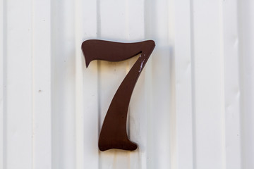 house number seven on a front house wall