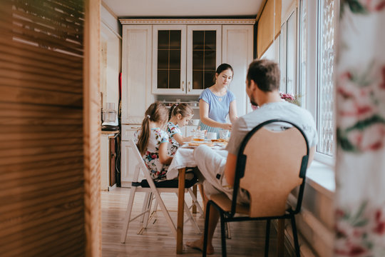 Family Breakfast At Home In The Nice Cozy Kitchen