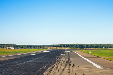 Runway with traces of rubber wheels of the aircraft free for takeoffs and landings at the airport