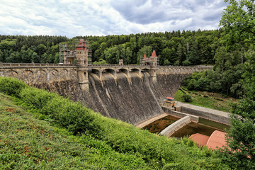 Old historic dam with repaired towers