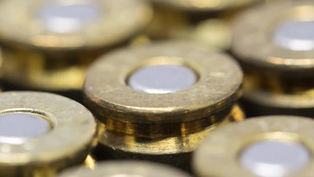 Dolly shot of Rows of 9mm bullet caliber with  shallow depth of field