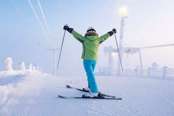 Skier, close-up, at the top of the ski slope. Morning on the mountain Levi, Lapland Finland.