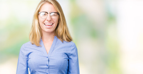 Beautiful young business woman over isolated background winking looking at the camera with sexy...
