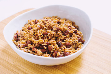 Rice and Beans in White Bowl on Wooden Surface
