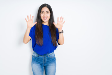 Fototapeta na wymiar Beautiful brunette woman over isolated background showing and pointing up with fingers number ten while smiling confident and happy.