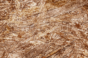 Brown chip board background. Wooden osb plywood pattern texture.
