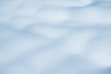 Fresh snow background texture. Winter background with snowflakes and snow mounds. Snow lumps.