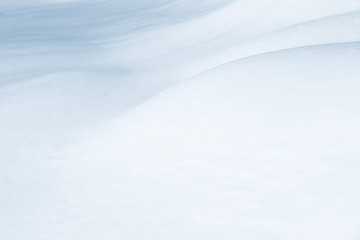 Fresh snow background texture. Winter background with snowflakes and snow mounds. Snow lumps.