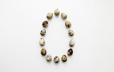 Quail eggs are on a white background there is a place for an inscription
