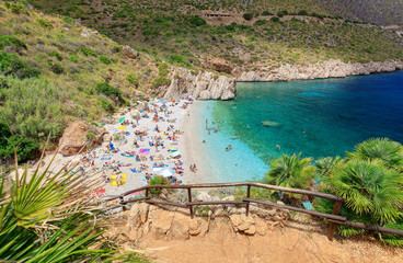 Naklejka premium Zingaro / Italy - 17 July 2018: Riserva Naturale Orientata dello Zingaro - Seaside nature park with coastline cliffs, rare plants, museums, picnic areas & trails to the sea