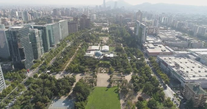 Drone View of Gardens Near City Skyscrapers