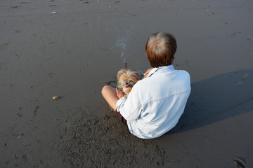 someone who is praying on the beach