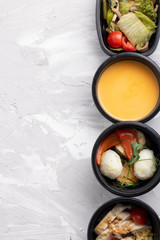 pumkin cream soup in black box, salad and copy space