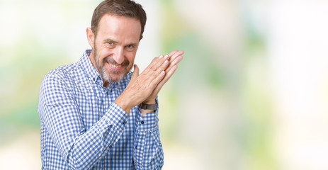 Naklejka na ściany i meble Handsome middle age elegant senior man over isolated background Clapping and applauding happy and joyful, smiling proud hands together