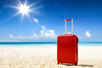 Summer suitcase on beach and sea landscape 