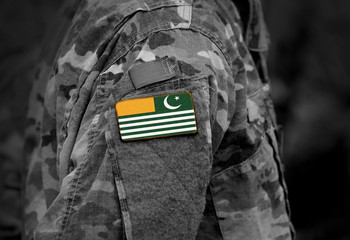Flag of Azad Kashmir on soldiers arm. Flag of Azad Jammu and Kashmir on military uniform (collage).