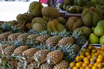 pineapples and durians in the market