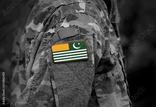 Flag of Azad Kashmir on soldiers arm. Flag of Azad Jammu and Kashmir on military uniform (collage).