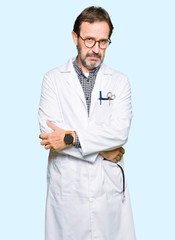 Middle age doctor men wearing medical coat skeptic and nervous, frowning upset because of problem....