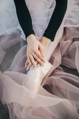 Obraz na płótnie Canvas Legs of ballerina in ballet shoes. Classical dance, ballet