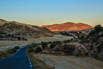 raod leads to sunset mountains