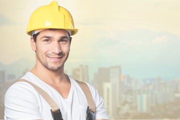 Portrait of happy young foreman with hard hat
