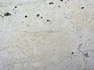 gray concrete wall texture with cracks scars and cavities