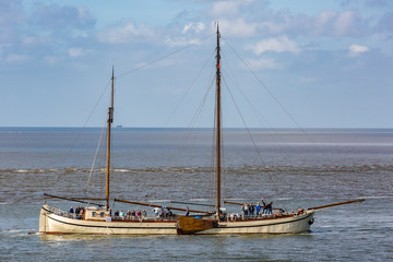 Antique sailboats on the Dutch Waddensea on a sunny day