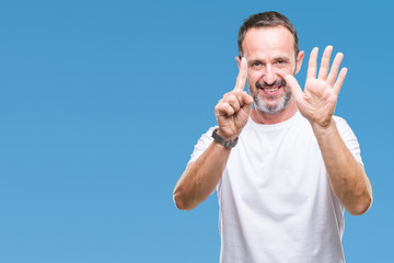 Middle age hoary senior man wearing white t-shirt over isolated background showing and pointing up with fingers number six while smiling confident and happy.