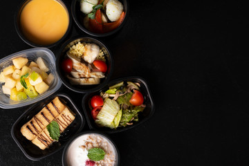 ready meal to eat into plastic food boxes, top view