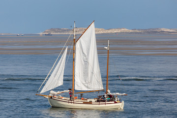 Antique sailboats on the Dutch Waddensea on a sunny day