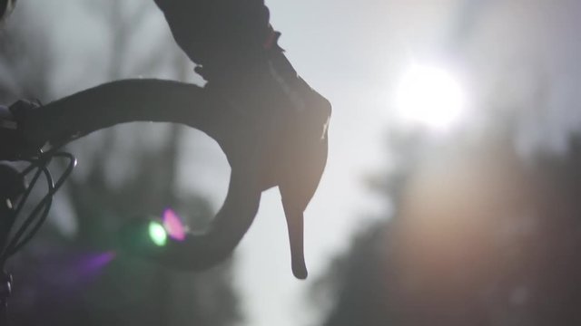 Handlebar Bike At Sunrise.Cyclist Hold Road Bike Handlebar.Biker Placing Hands On Handlebar Grips.Bicycle Handlebar And Hand Detail. Bicycle Handlebar Close-Up.Hand Grips Bike Handlebar, Closeup. 