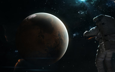 Mars, an astronaut in blue light. Solar system, beautiful space landscape. Science fiction art. Elements of the image were furnished by NASA