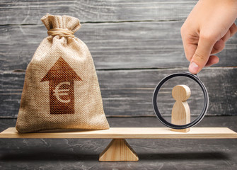 Magnifying glass is looking at a man figurine and Euro money bag with arrow up on scales. average salary in the labor market, pricing. Criteria and requirements for increasing the work of a specialist