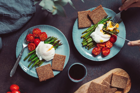 View From Above On Dinner For Two People, Poached Egg On Grill Asparagus And Cherry Tomatoes.