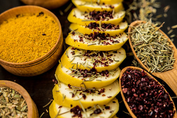 squash yellow cut slices seasoning spices herbs rosemary sumac taste raw diet taste traditional ingredients wooden