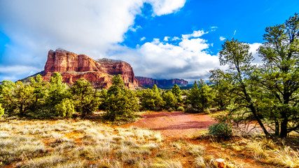 Clouds and blue sky over Courthouse Butte between the Village of Oak Creek and the town of Sedona in northern Arizona in Coconino National Forest, United States of America