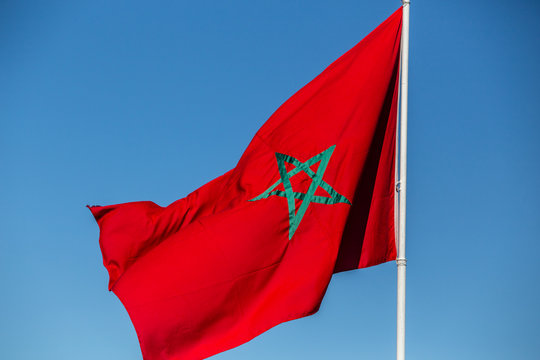 flag of Morokko against blue sky