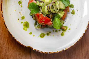 fresh vegetable salad with butter and sauce