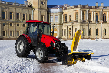 snow combine harvests dirty snow on the road. Gatchina, Russia. snow removal, reportage shooting.