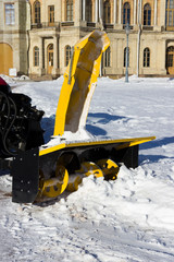snow combine harvests dirty snow on the road. Gatchina, Russia. snow removal, reportage shooting.